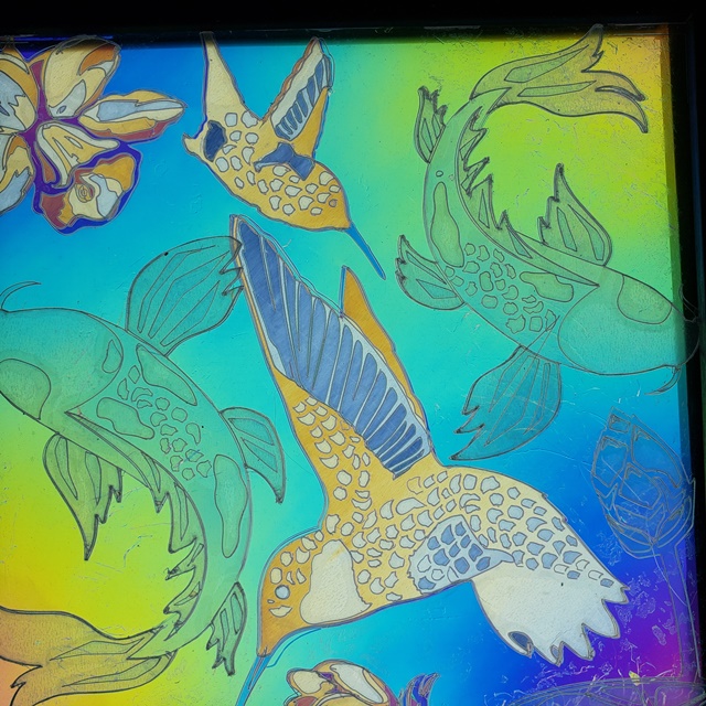 overlay of hummingbirds and koi fish